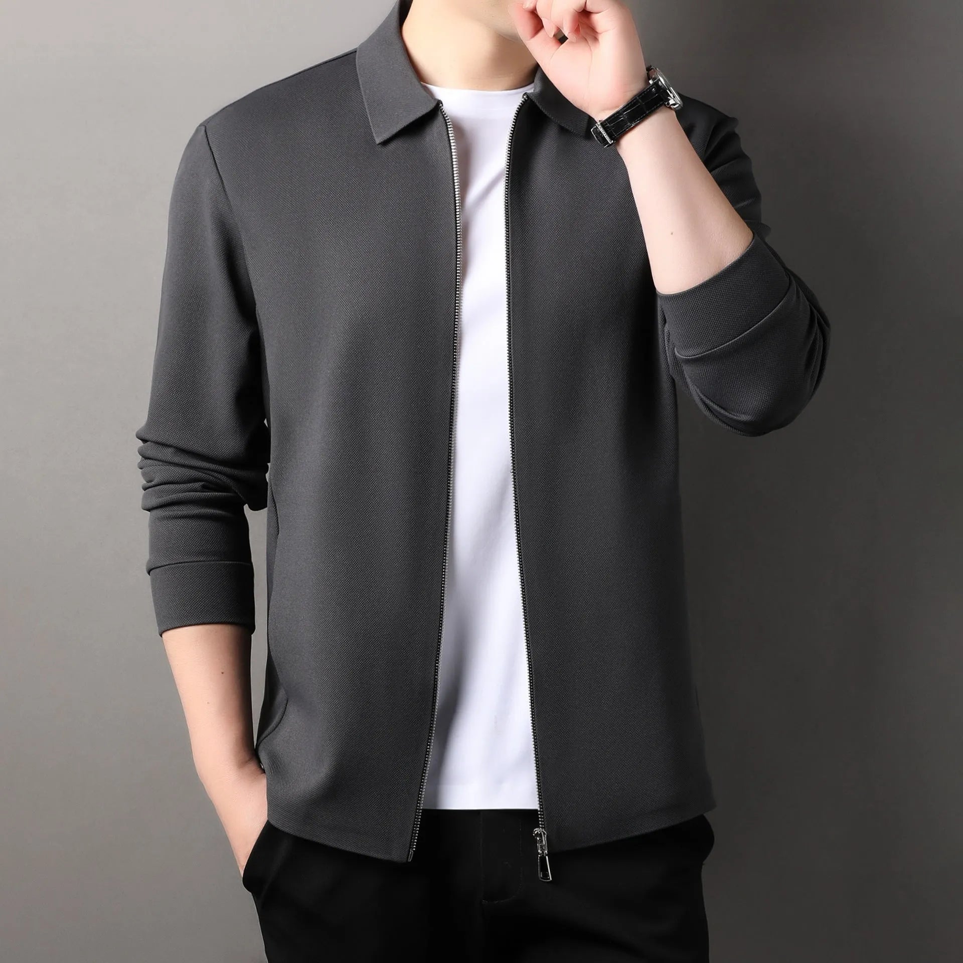Men's black polyester casual business jacket with long sleeves on a hanger.