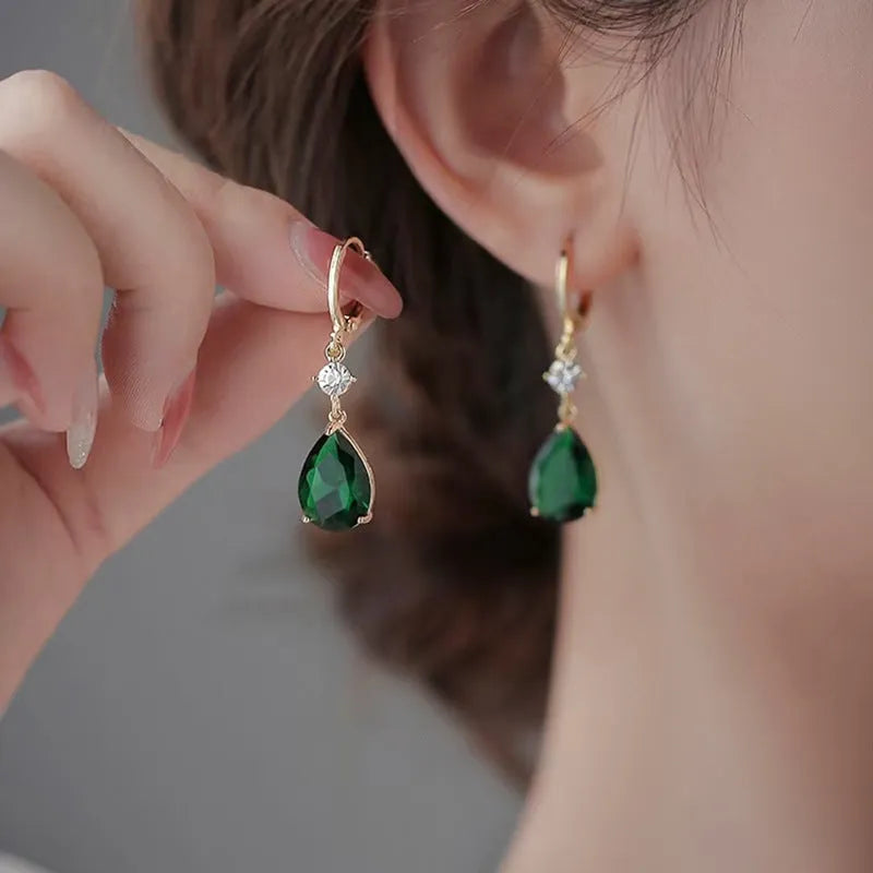 A pair of green geometric teardrop fashion earrings made from alloy.