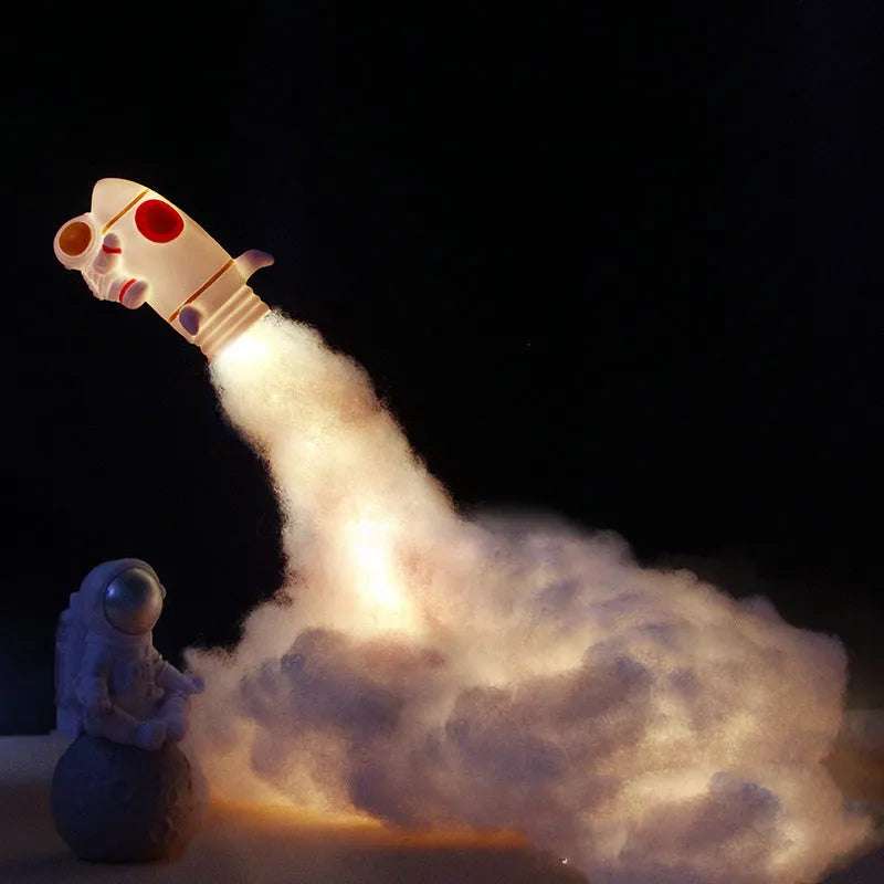 DIY astronaut rocket night light kit components including rocket model, LED string lights, chassis and assembly materials