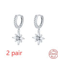 Sterling silver snowflake pendant earrings showing geometric design with gold-colour finish options