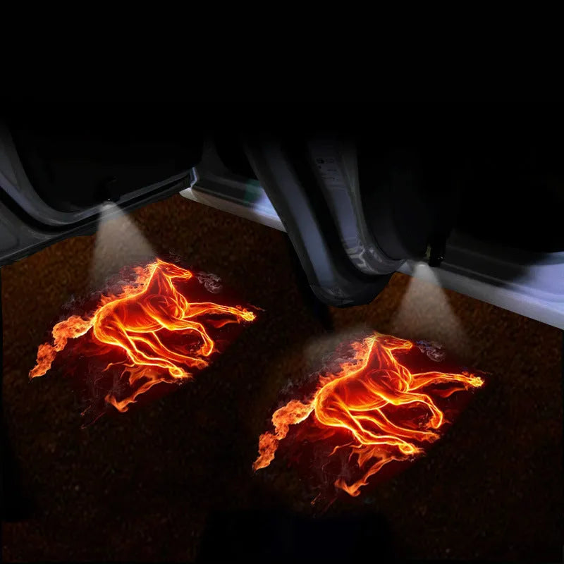 Black F2 USB rechargeable car welcome light projecting illuminated image on ground.