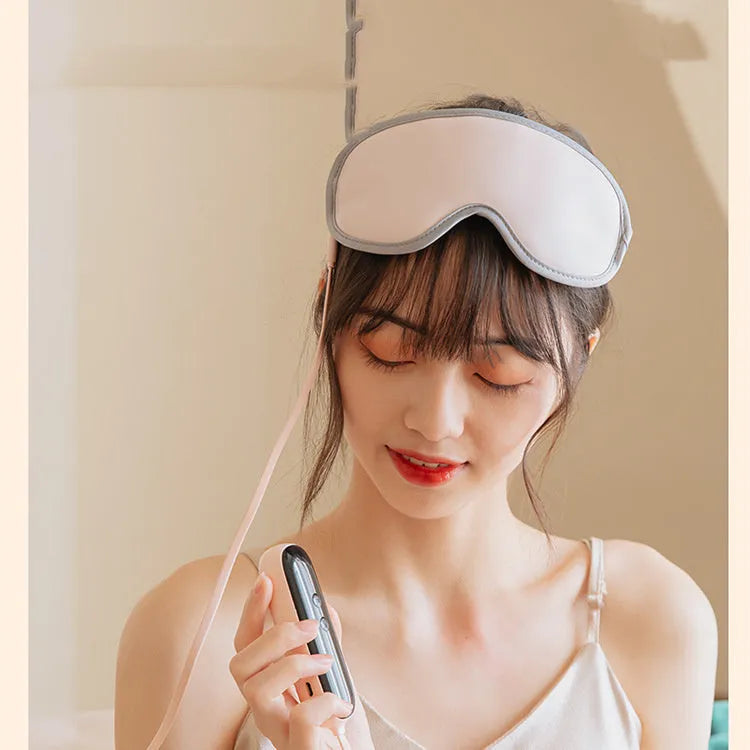 Pink and green portable eye massage goggles with steam and heating functions