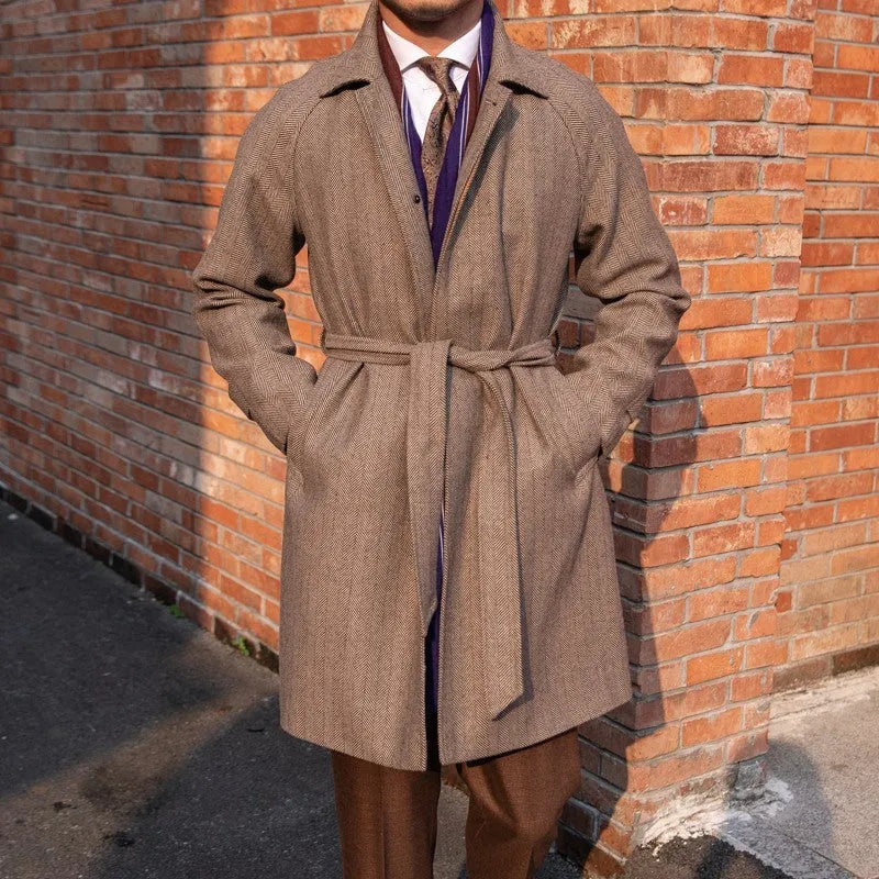 Men's herringbone wool slim fit mid length coat in blue with lapel collar and single-breasted placket