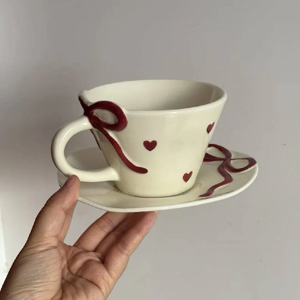 Hand painted white porcelain coffee cup with cherry design and matching coaster