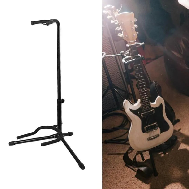 Black foldable metal guitar stand with rubber pads, holding an acoustic guitar.