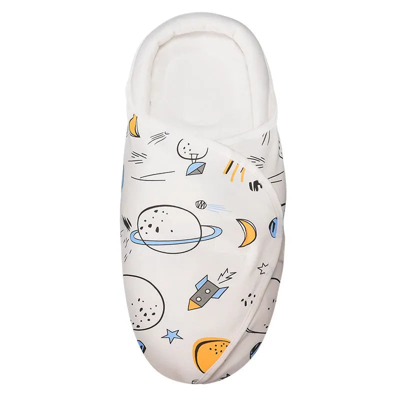 Cotton anti-startle swaddle blanket for babies in a colourful dinosaur print, 30 by 60 cm.