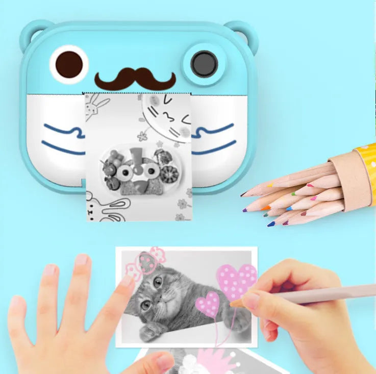 Blue, green, and pink coloured HD digital camera with 2.4-inch screen and accessories including printing paper.