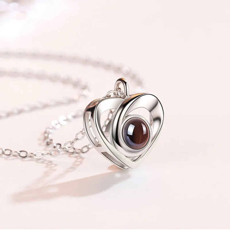 S925 silver heart shaped photo projection pendant necklace with silver finish on white background