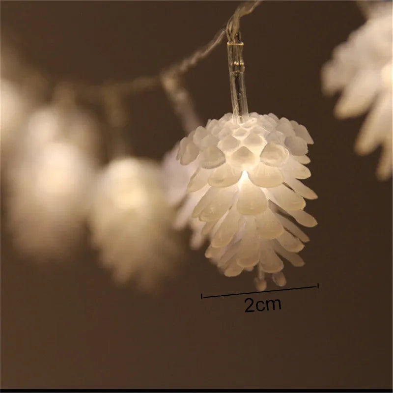LED pine cone decorative light string with warm white bulbs and plastic shells, battery powered for flexible placement