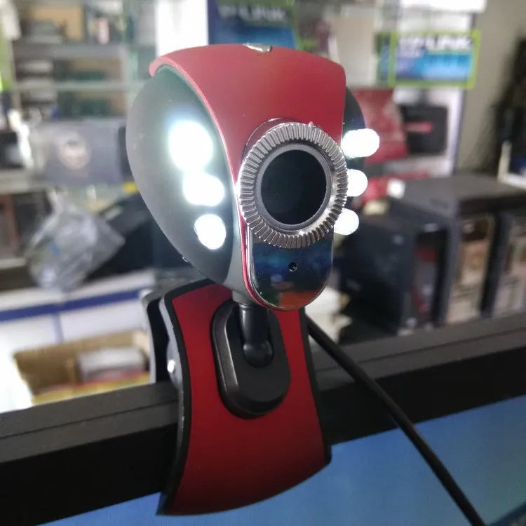 USB computer camera in red and black with CMOS sensor, 640x480 video, F6.0mm lens, and 84g weight