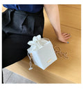 Small women's one shoulder messenger bag with chain detail in bucket shape