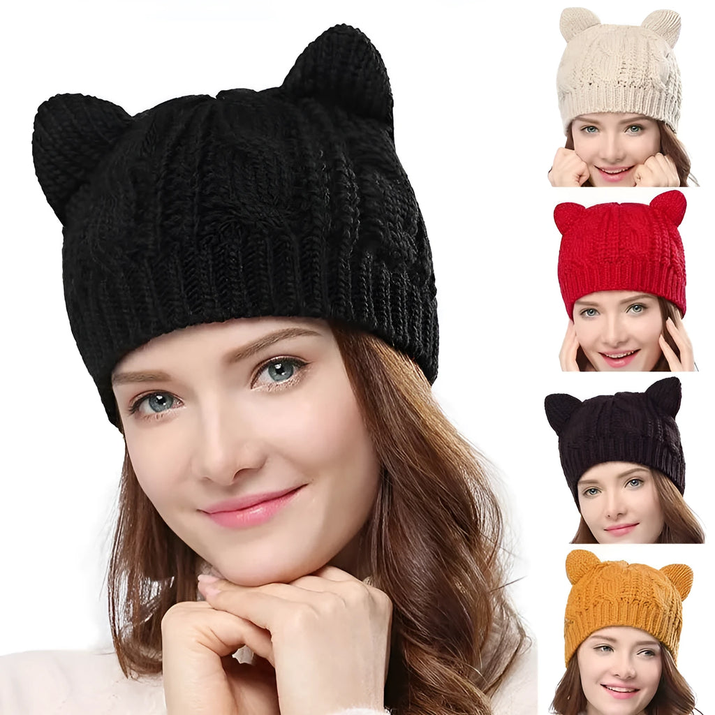 Hand made red knitted beanie hat with 3D cat ears on a white background