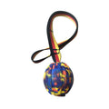 Yellow and camouflage coloured EVA floating knot balls for dogs in three different sizes on a blue background.