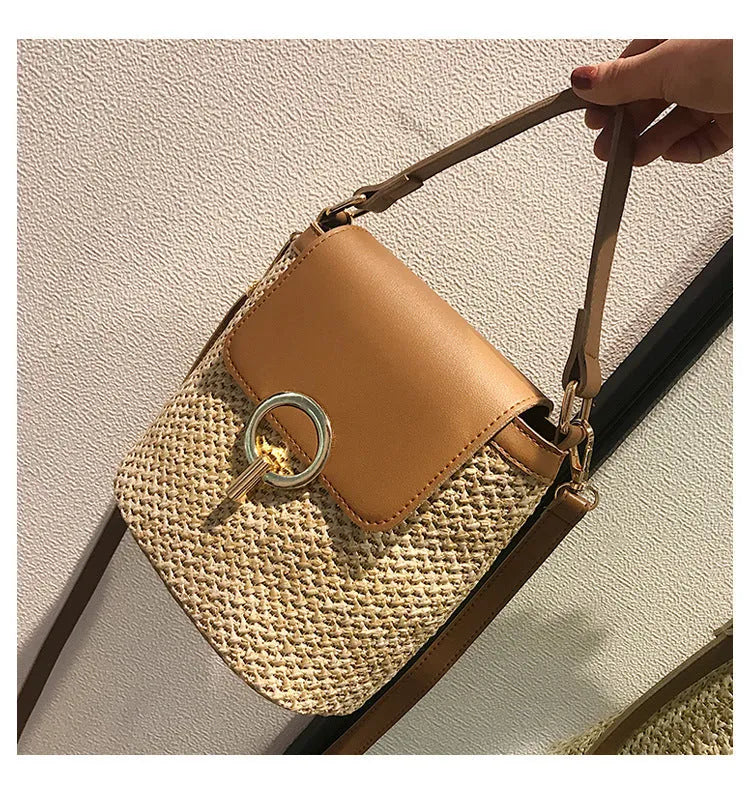 Women's straw woven bucket shoulder bag in black with cover flap, small size, polyester lining