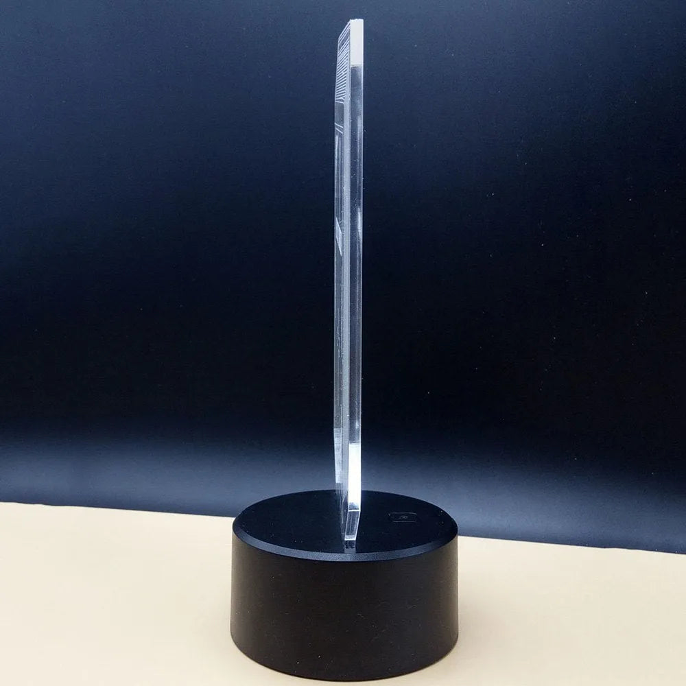 3D acrylic illusion desk lamp with colourful LED lights on a black ABS base, showing remote control.