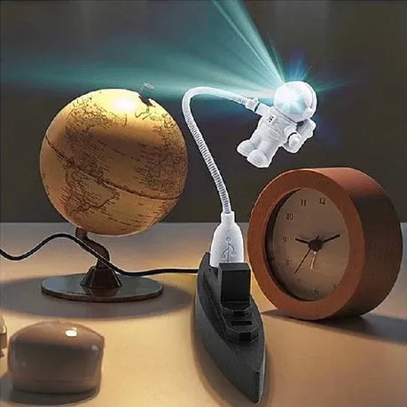 Astronaut USB LED desk lamp with flexible gooseneck and helmet switch on a desk