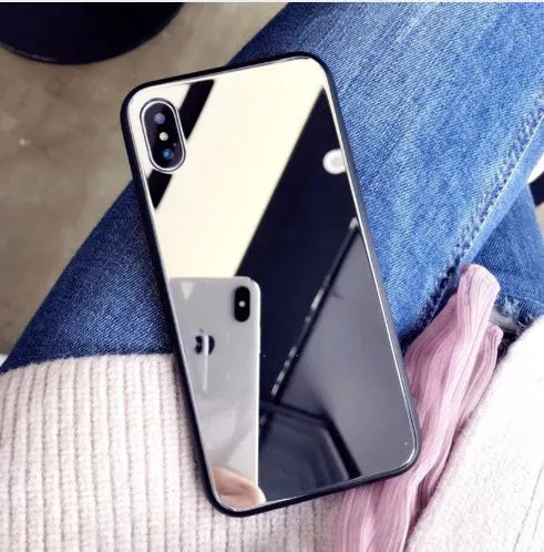 Black iPhone back cover case with a reflective mirror surface and self-timer function.
