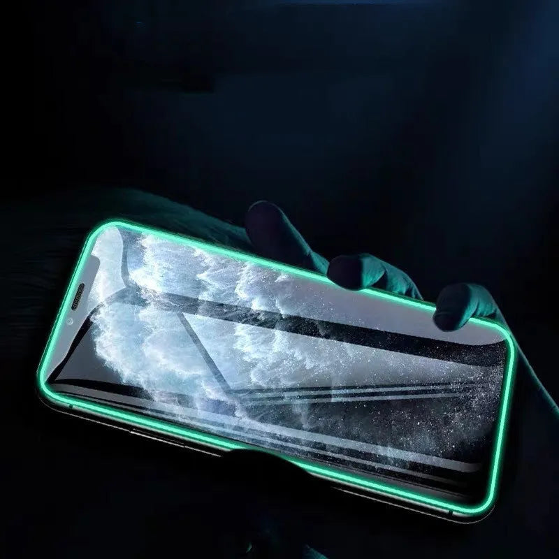 Luminous full cover tempered glass screen protector glowing for iPhone on a dark background.