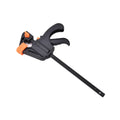 Black woodworking F clip 4 inch with plastic body and carbon steel rod on wooden board
