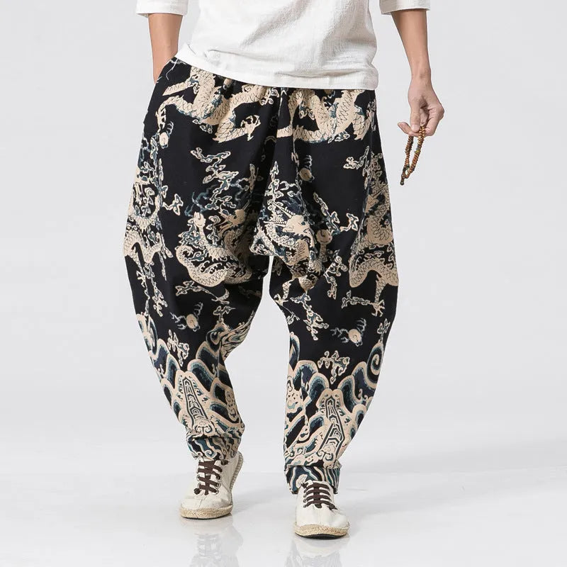 Men's hip hop cross pants with dragon print pattern and elastic waist in loose harem style.