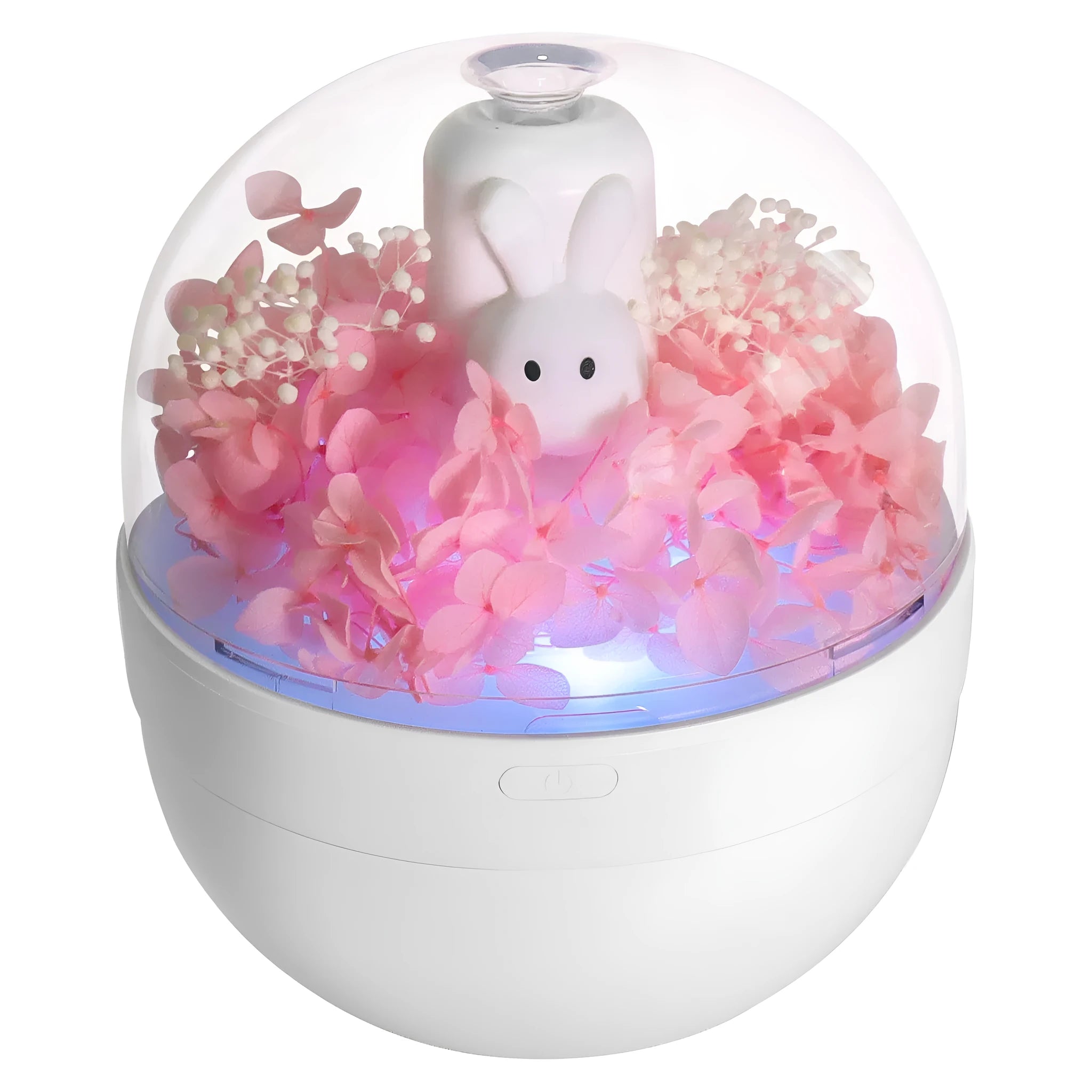 Pink rabbit-shaped aromatherapy humidifier with preserved flower decoration on bedside table