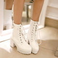 Women's short PU martin boots with thick high heel in black, side view showing lace-up front and ankle-high tube
