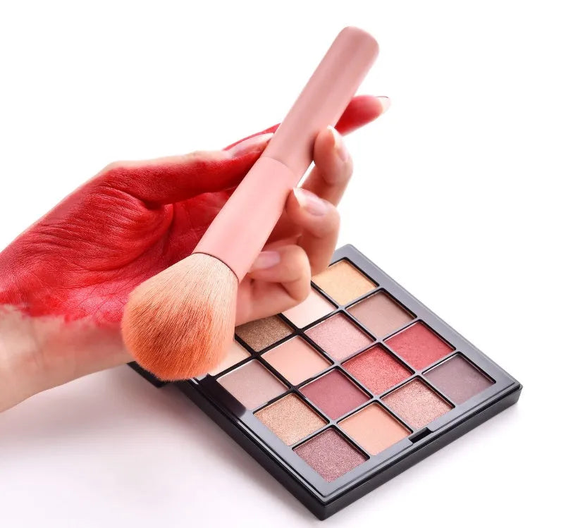 10 professional makeup brushes with wooden handles in a pink case including foundation, powder, and dual-ended brushes