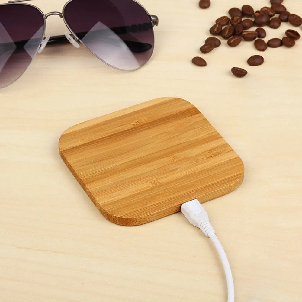 Square wooden bamboo 5W wireless charging pad for smartphones on a desk