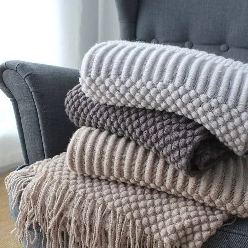 Small light grey polyester nap blanket laid flat showing 127x170cm size.