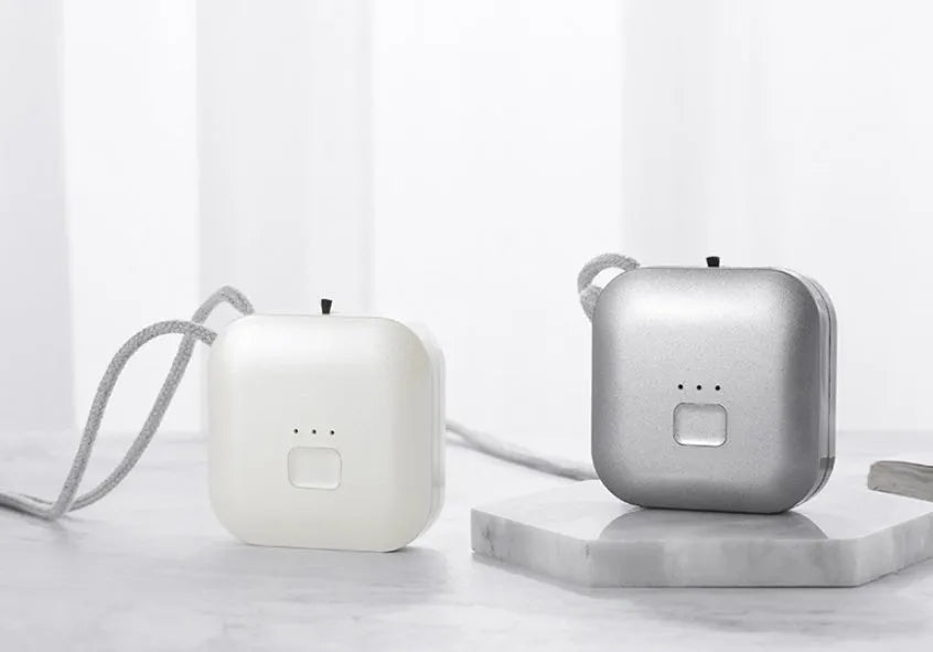 USB portable air purifier necklace in blue, pink, grey or white colour options.