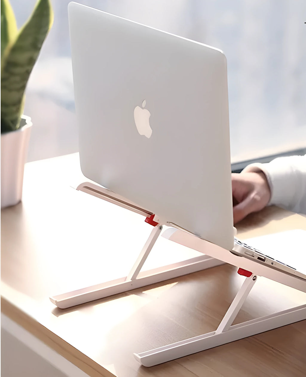 White portable laptop bracket with heat sink base in folded position.