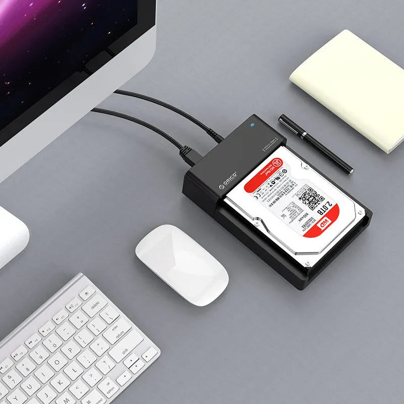 Black universal hard drive enclosure for 2.5-inch and 3.5-inch SATA drives with USB cable