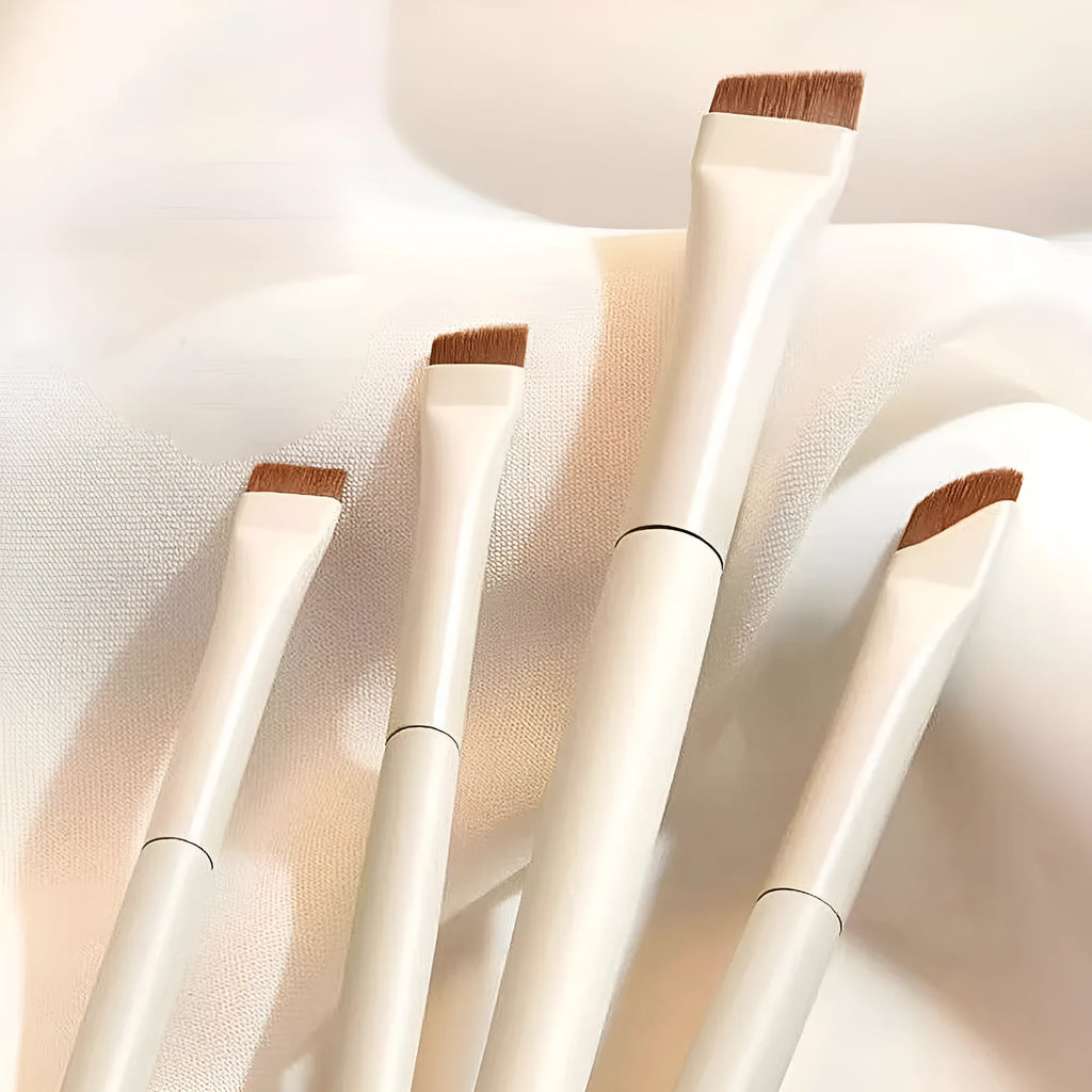 Four angled ultra-thin eyeliner and brow brushes in a leather case.