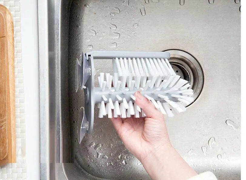 Grey rotating double-headed cup brush with suction cups for wall attachment