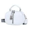 Women's small oval crossbody bag in PU with stitching detail and double straps, shown in multiple colours.