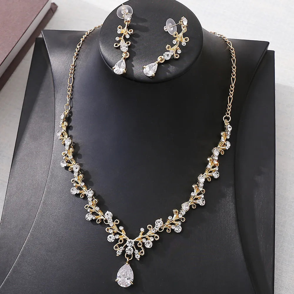 Bridal rhinestone zircon earring and necklace set in silver white finish on alloy base.