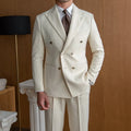 Men's slim double breasted suit set in off-white with two-button front and long sleeves, shown on hanger