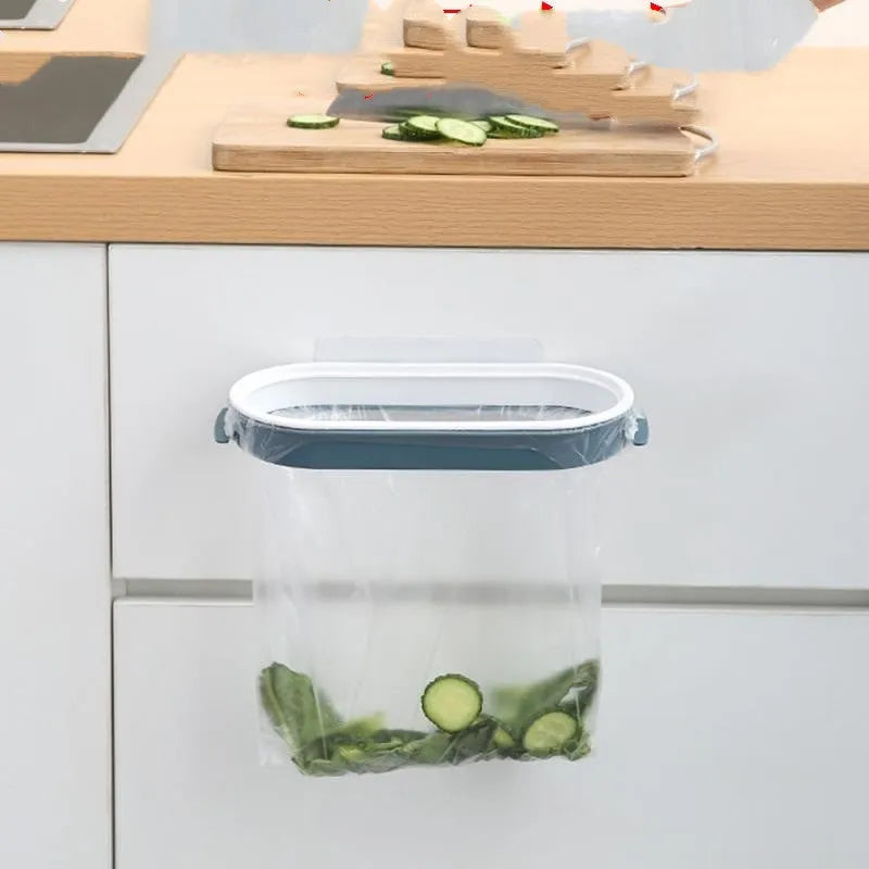 Blue plastic kitchen garbage bag storage rack mounted on cabinet door
