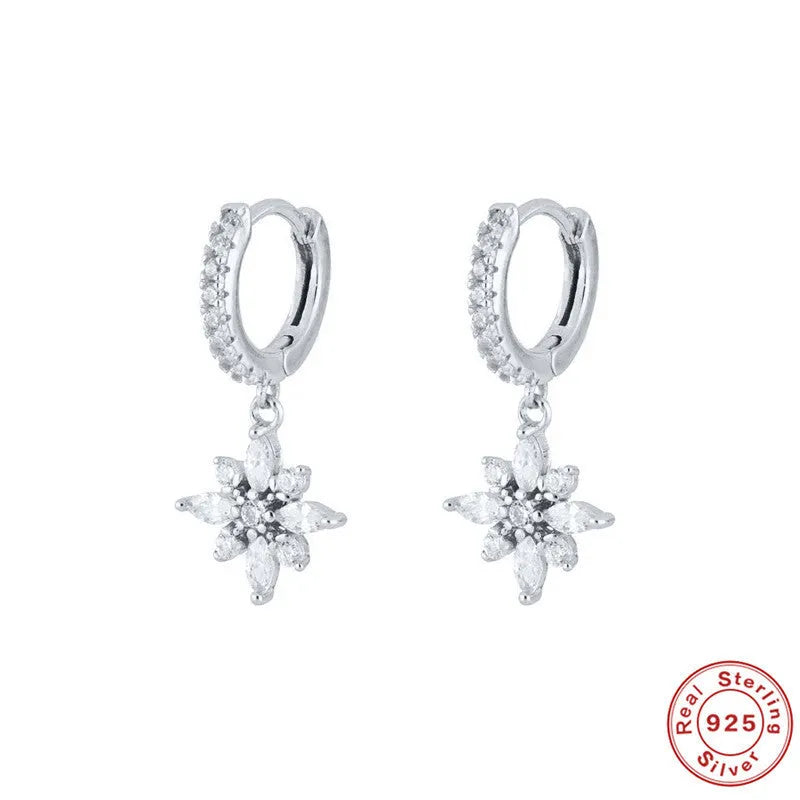 Sterling silver snowflake pendant earrings showing geometric design with gold-colour finish options