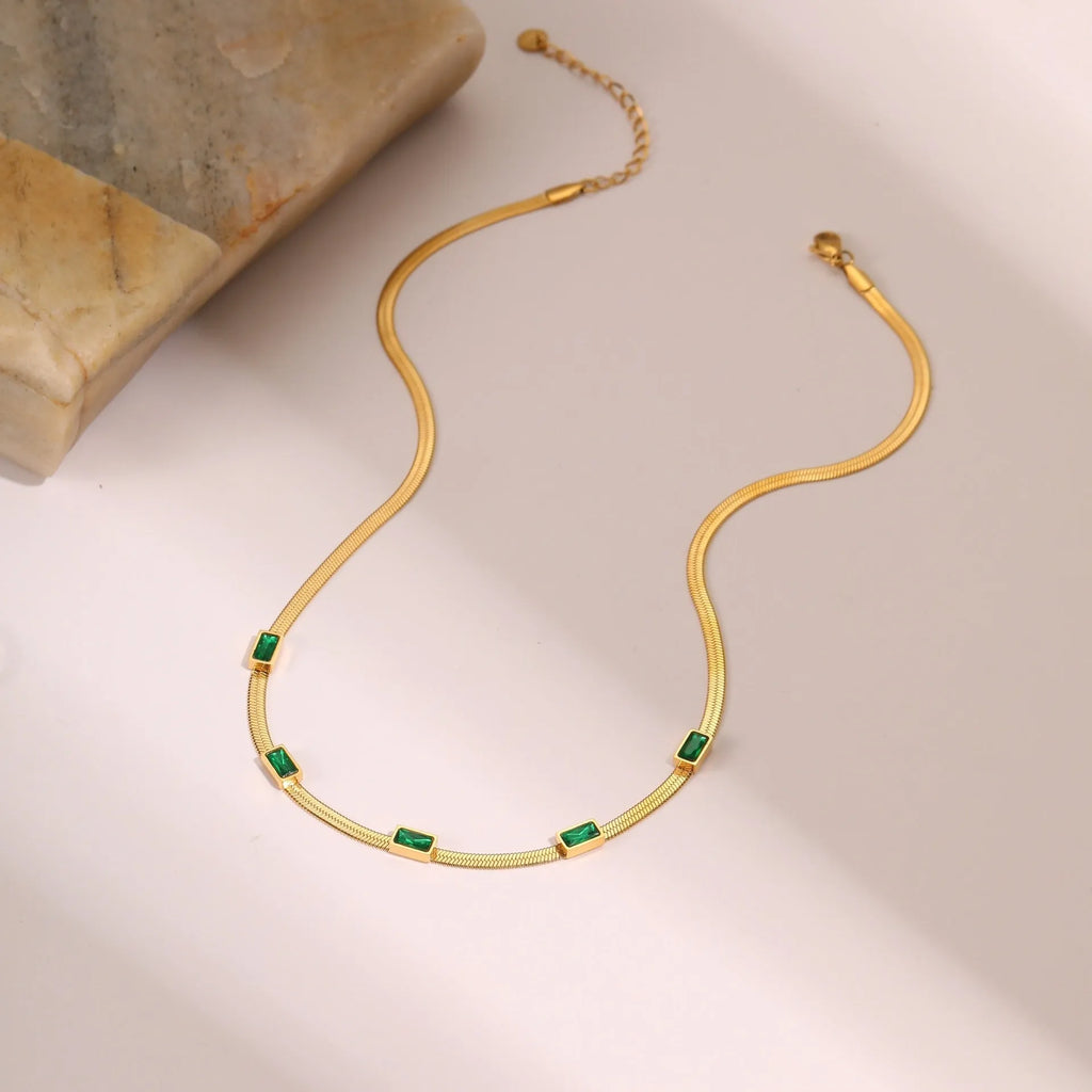 Retro geometric square zircon necklace on a flat snake chain in gold electroplated stainless steel.
