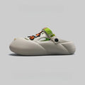 Men's grey beach shoes with open-hole design and covered toe protection on sandy surface