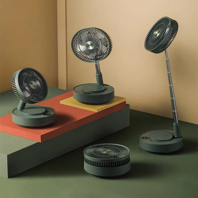 Green telescopic floor fan extended to full height with remote control resting beside base