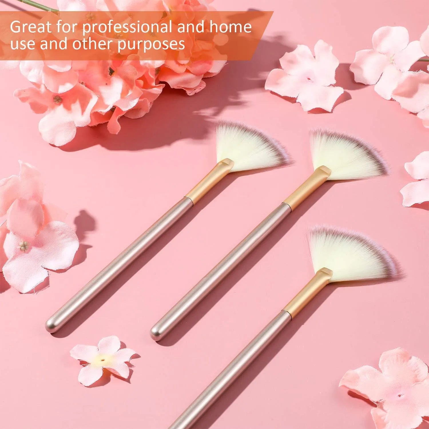 Ten champagne-coloured fan makeup brushes with soft fibre bristles and protective covers laid out.