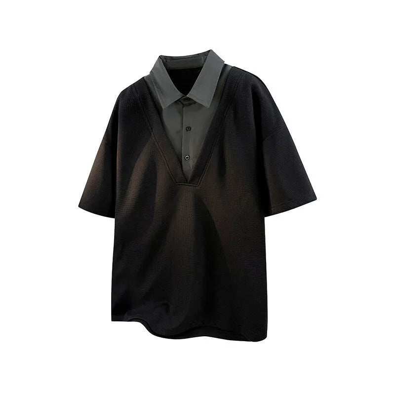 Man wearing a black padded Henry collar polo shirt sweater with short sleeves.