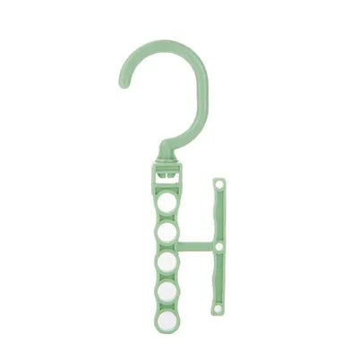 Blue revolving plastic wardrobe hanger with five arms and a top handle for rotation.