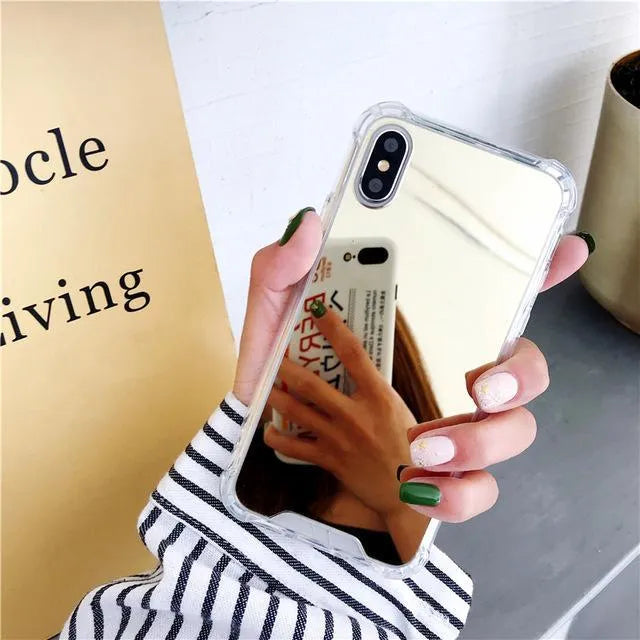 Mirror finish iPhone case with reflective surface showing TPU flexible construction and precise port cutouts