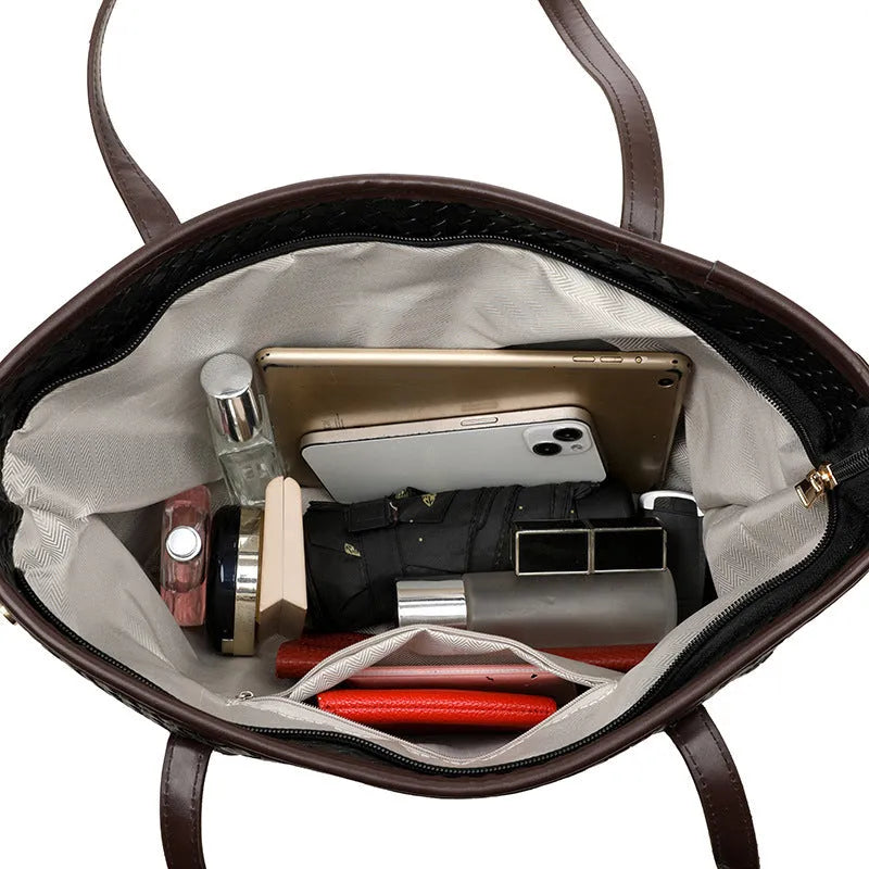 Retro women's large capacity black PU leather handbag with exterior pocket and horizontal square shape.