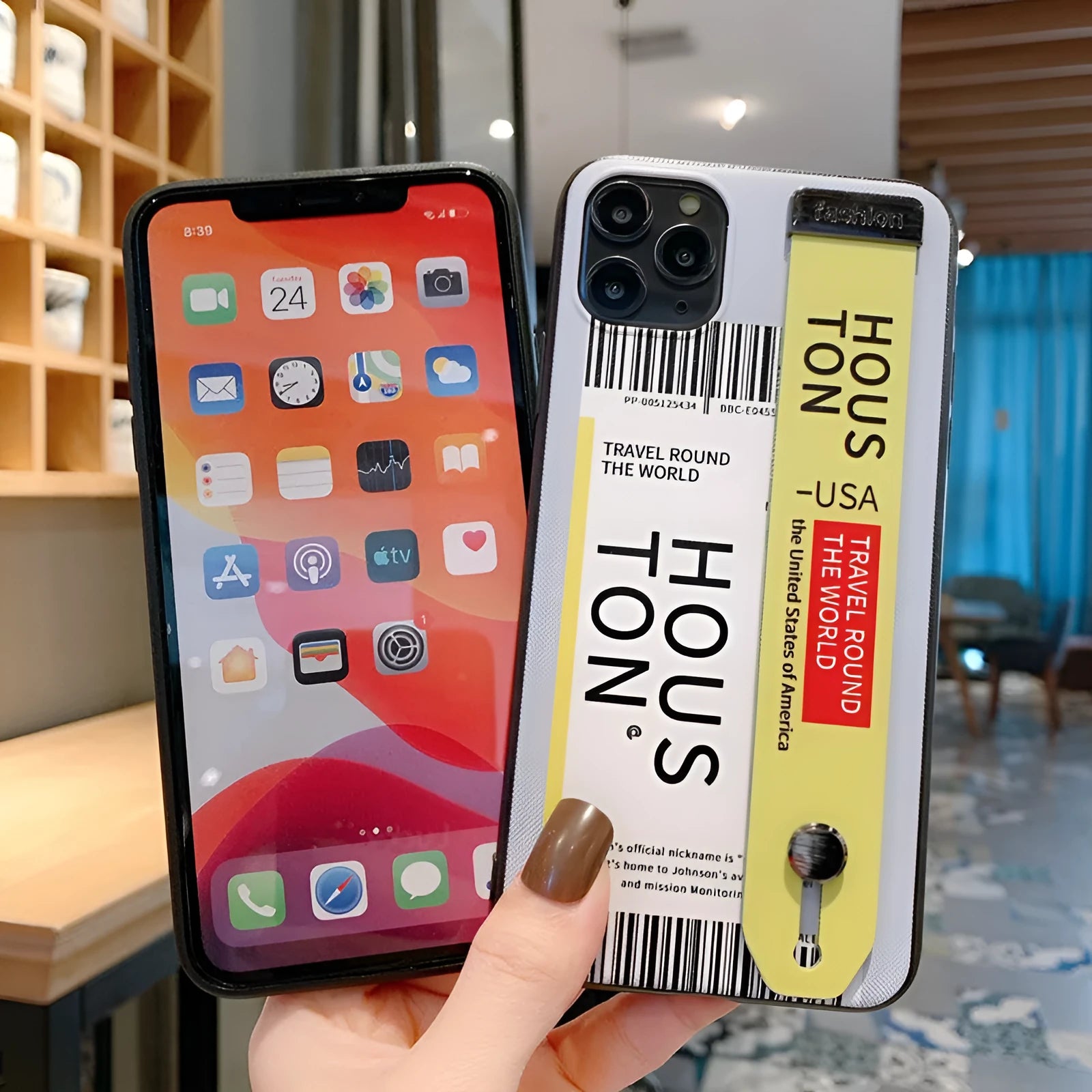 Red TPU and PC iPhone case with a built-in wristband, shown next to violet and yellow colour options.