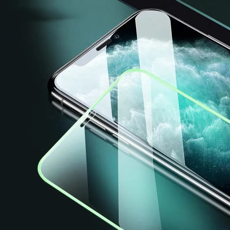 Luminous full cover tempered glass screen protector glowing for iPhone on a dark background.