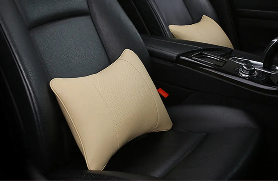 Breathable car headrest with leather cover, down yarn filling, and classic punched ventilation pattern